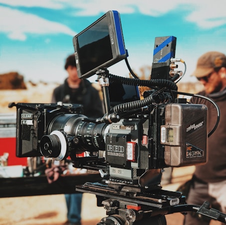 Empty cinema theater with rows of seats lit by projector light before a film screening