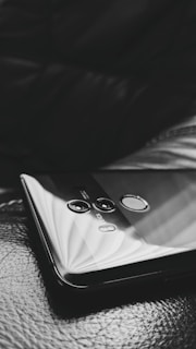 Close-up of biometric fingerprint scanner on a sleek device.