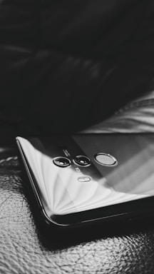 Close-up of biometric fingerprint scanner on a sleek device.