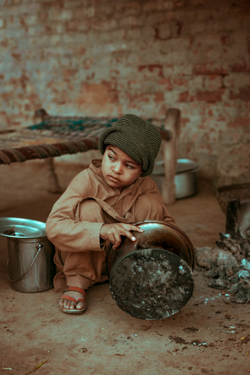 boy holding stock pot