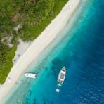 aerial photography of boats near shore