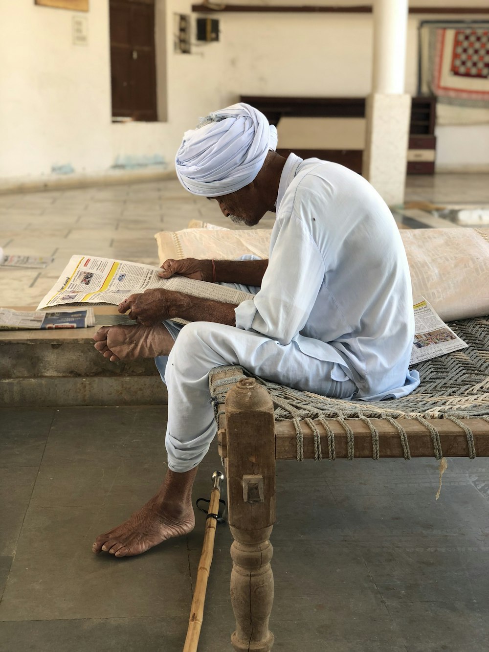 man sitting on bed