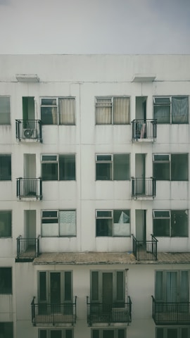 Exterior view of a building featuring white aluminum window frames