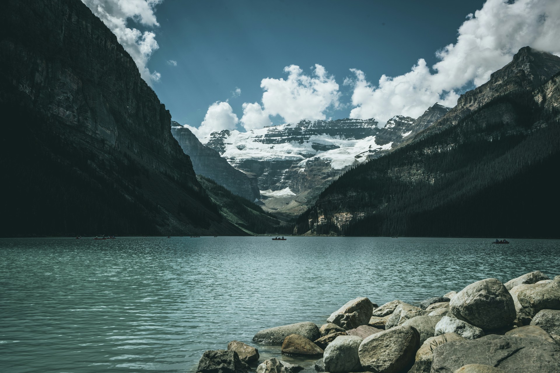 landscape photography of body of water between mountains