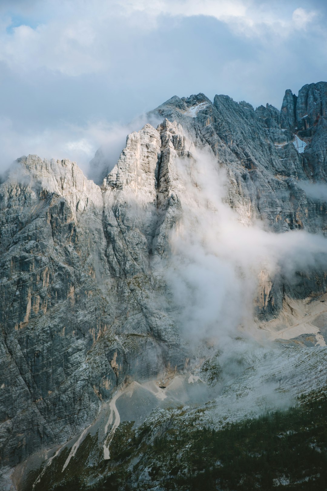 photo of foggy mountain during daytime