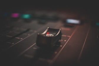 selective focus photography of mixing console