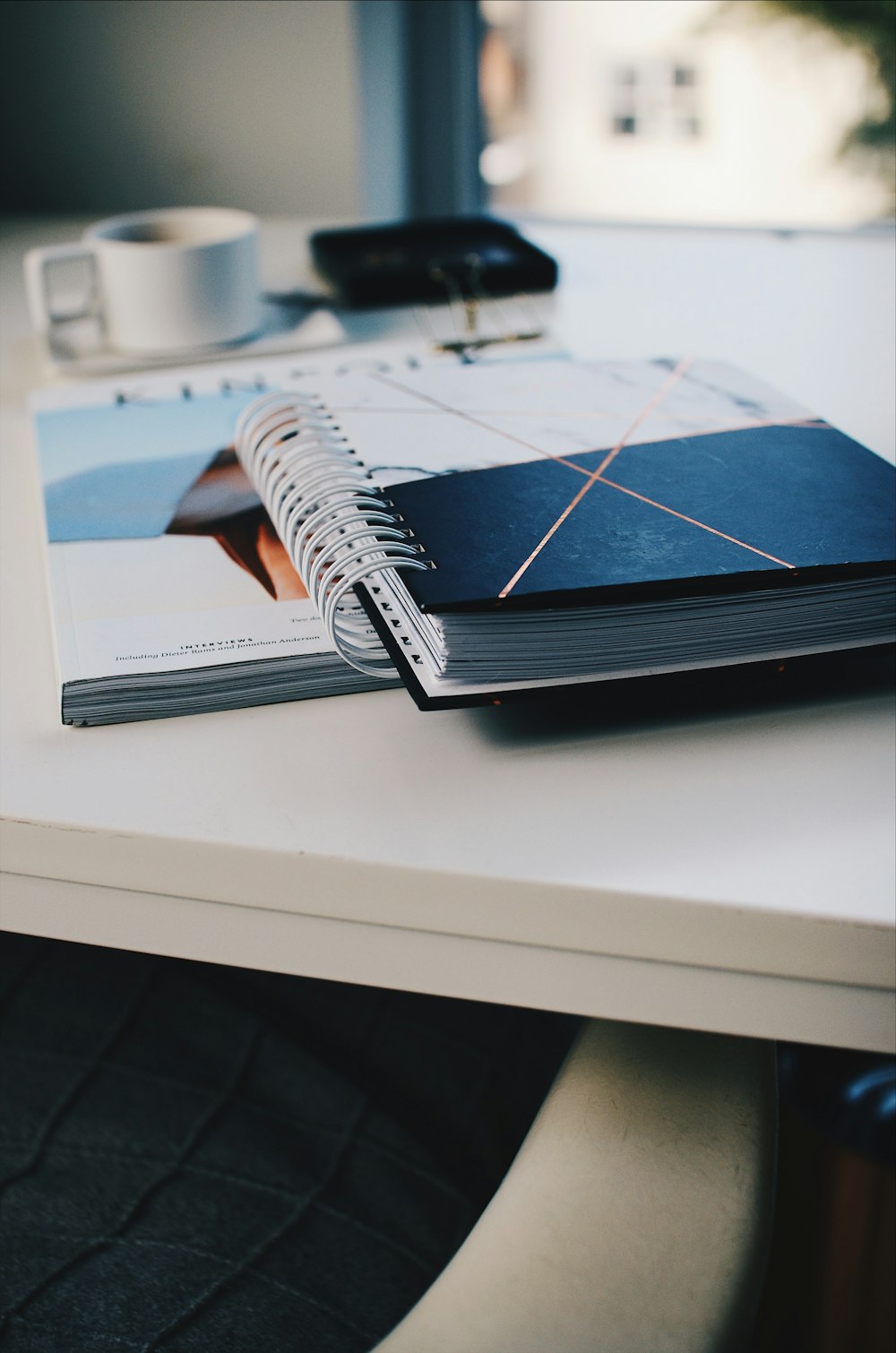 black and white spiral book on desk