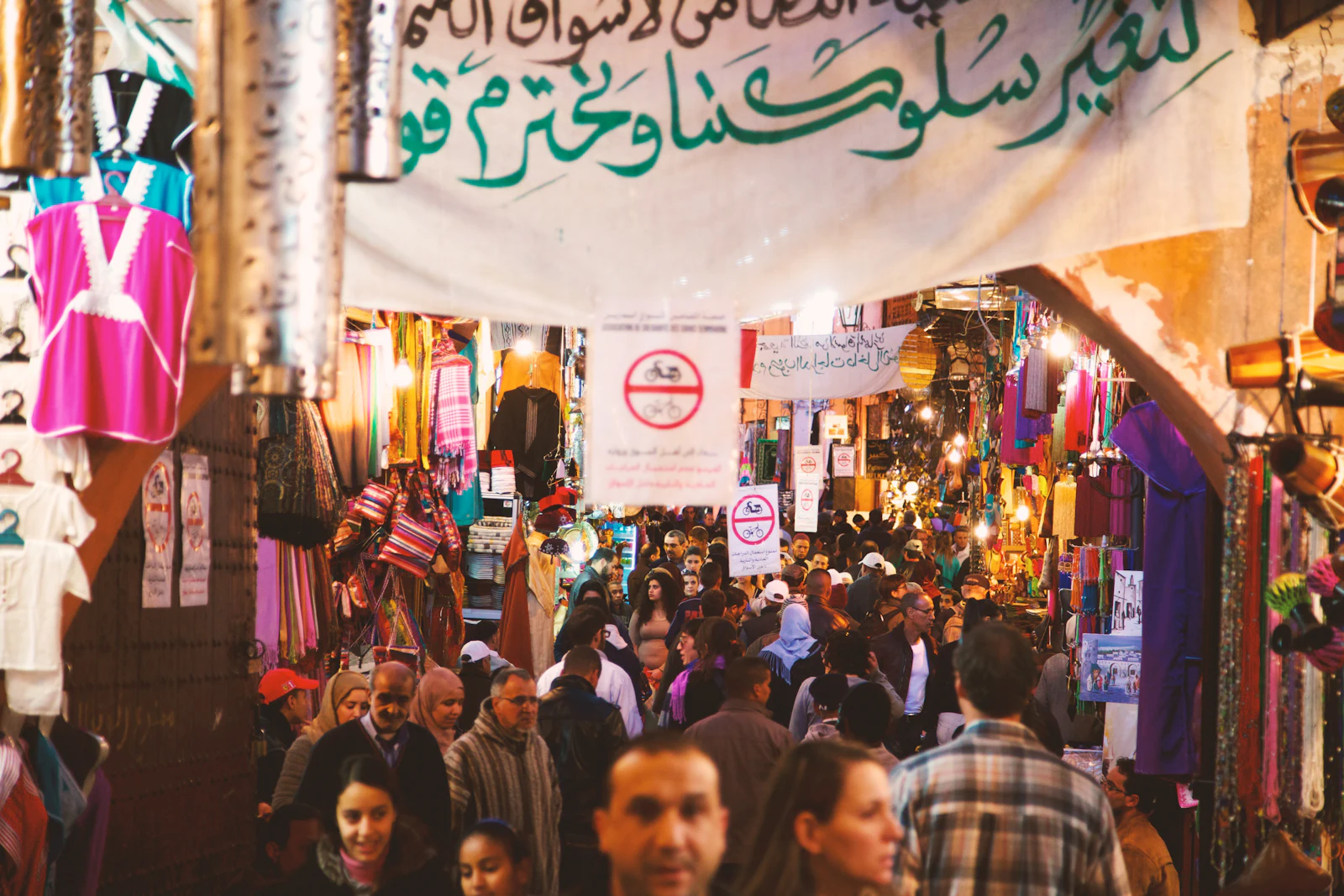 Food stalls glowing with smoke and lights at the Jemaa el-Fnaa night market in Marrakech