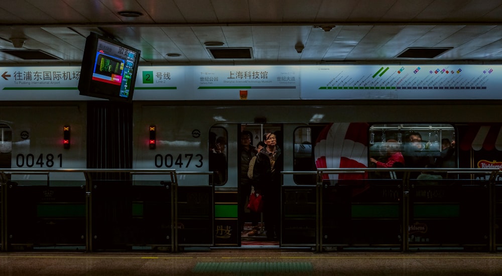 group of people riding train