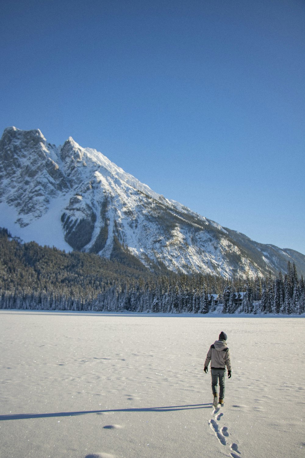 man walking in sand during daytime