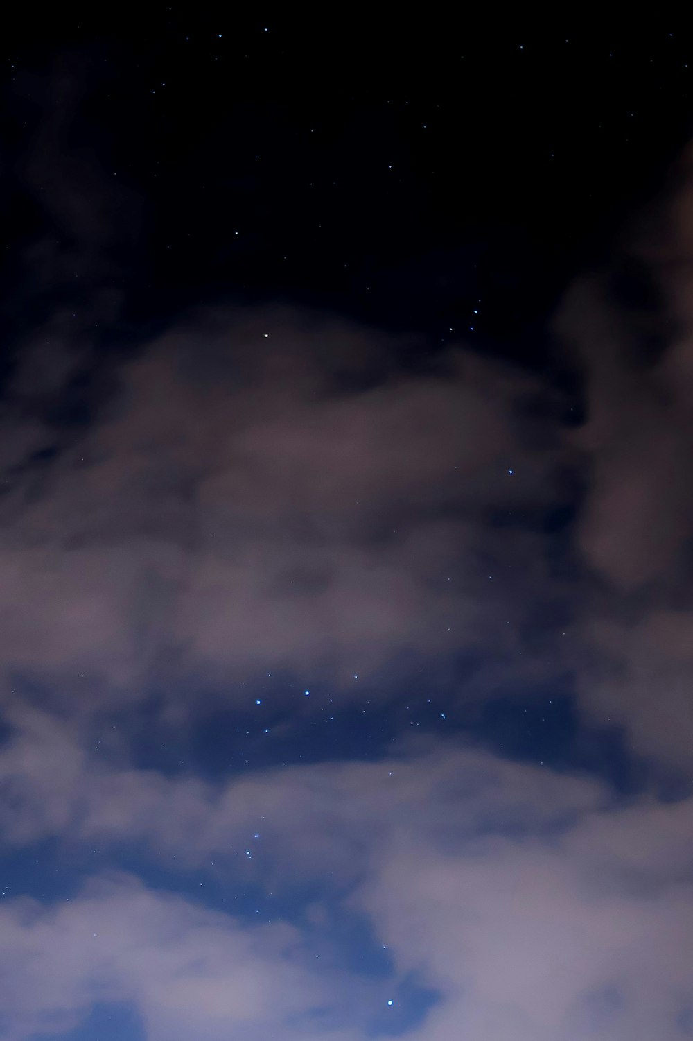 clouds under starry night