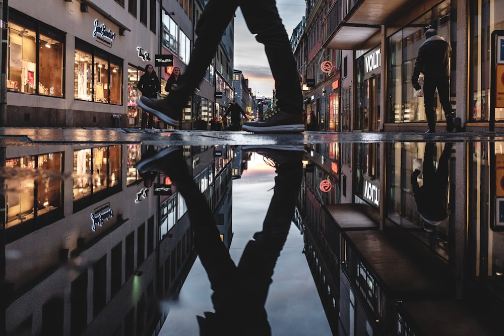 person reflecting on ground water