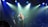 woman playing guitar on stage