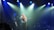 woman playing guitar on stage