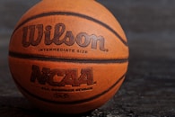 Wilson NCAA basketball on black board