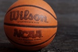 Wilson NCAA basketball on black board