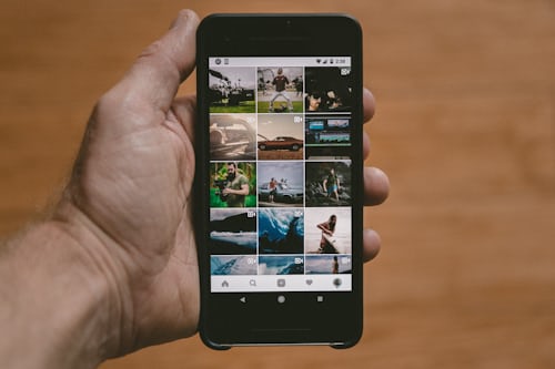 Phone screen displaying photos that can be reposted on Instagram. 