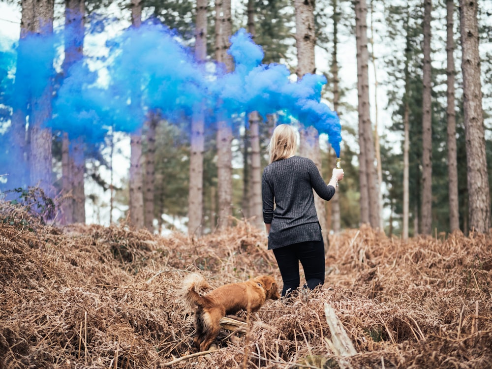 person holding blue smoke