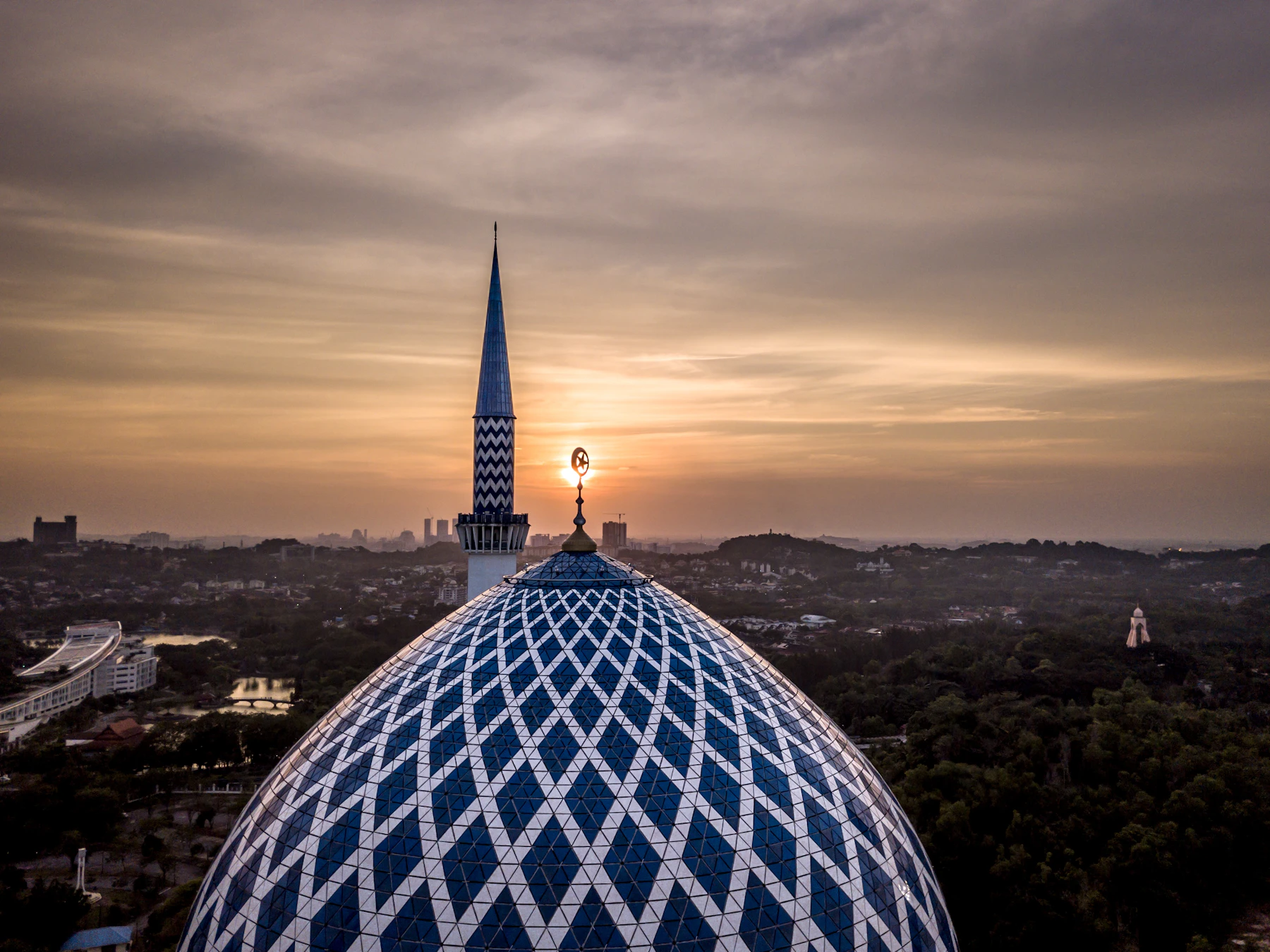 An elevated view across the blue dome of a mosque in Shah Alam
