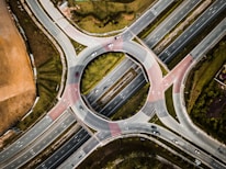aerial photography of vehicles running on vehicle intersection route at daytime