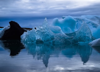 photo of icebergs during daytime