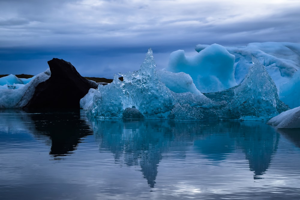 photo of icebergs during daytime