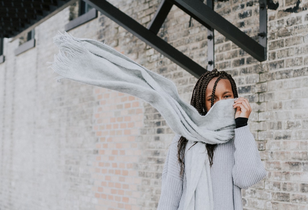 woman standing beside wall