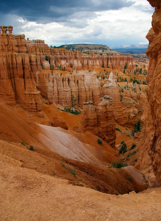 high rise mountain under cloudy sky at daytime in Bryce Canyon National Park United States