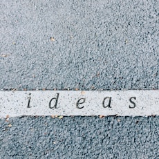 ideas carved on concrete surface