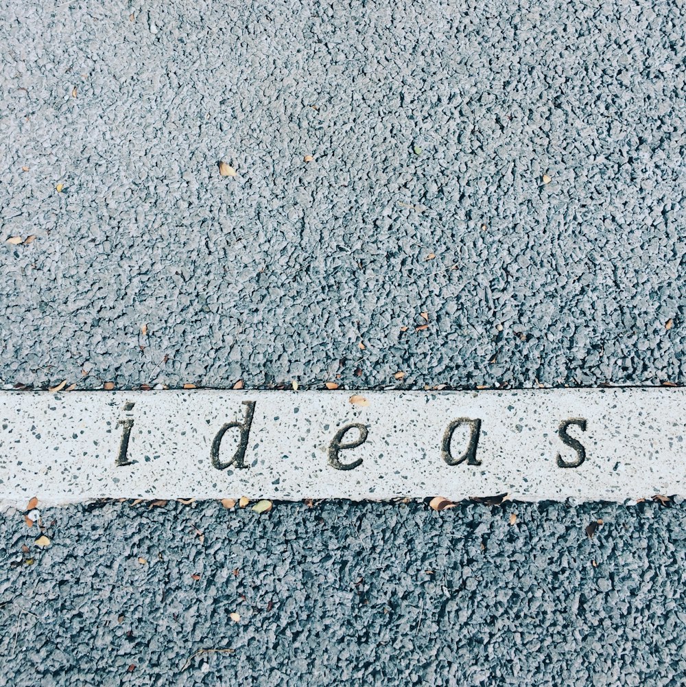 ideas carved on concrete surface