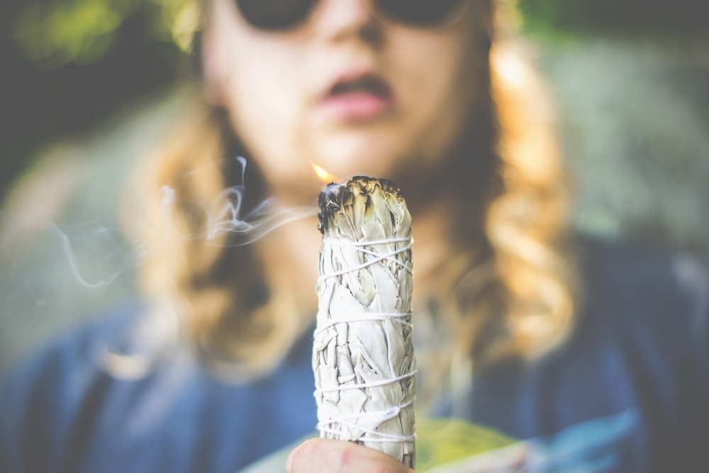 person holding burned paper