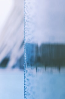 A close-up of a beautifully crafted icy smile logo with soft pastel colors.