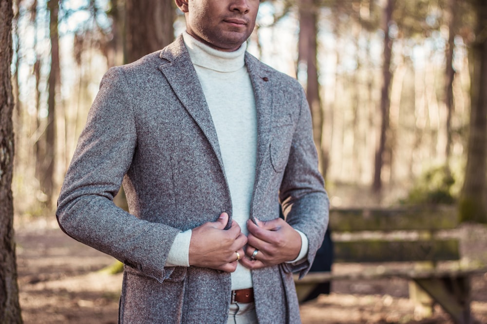 person holding gray coat