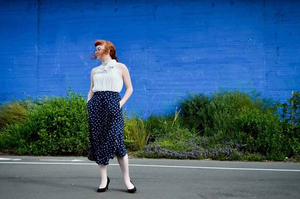 woman standing on road while hands in pocket