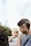 man holding baby in white shirt