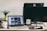 A computer workspace with digital products displayed on the screen.
