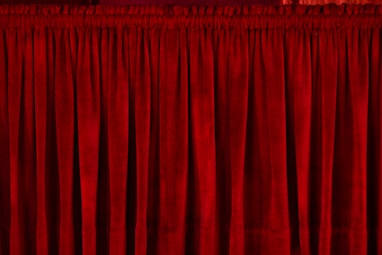 closeup photo of red rod pocket curtain