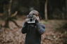 kid holding camera