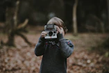 kid holding camera