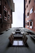 low angle photography of building with open windows at daytime