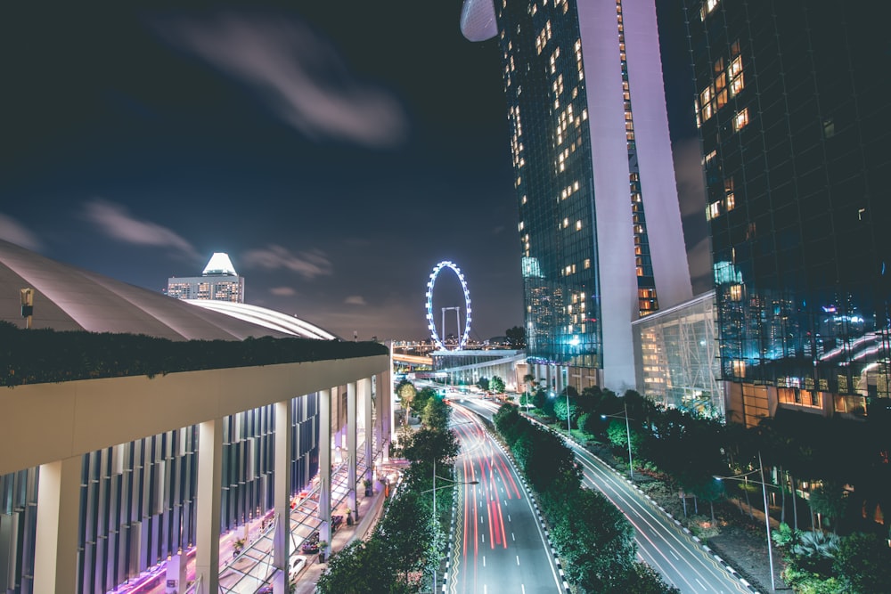 time lapse photography of Marina Bay Sands beside road