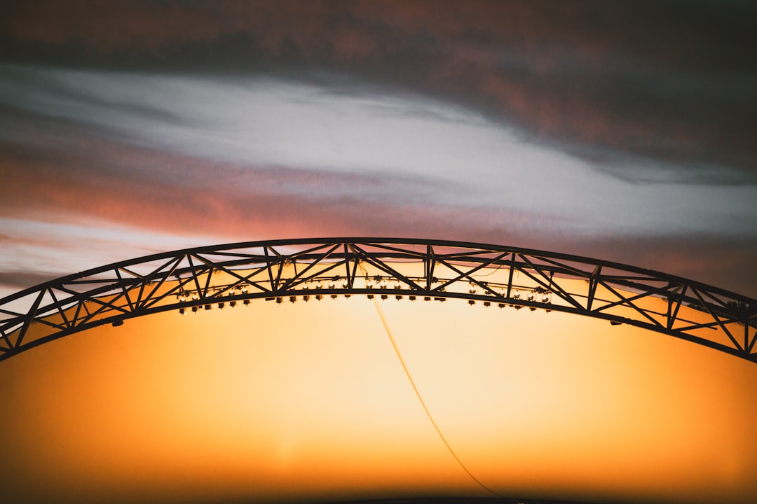 arch black truss during golden hour