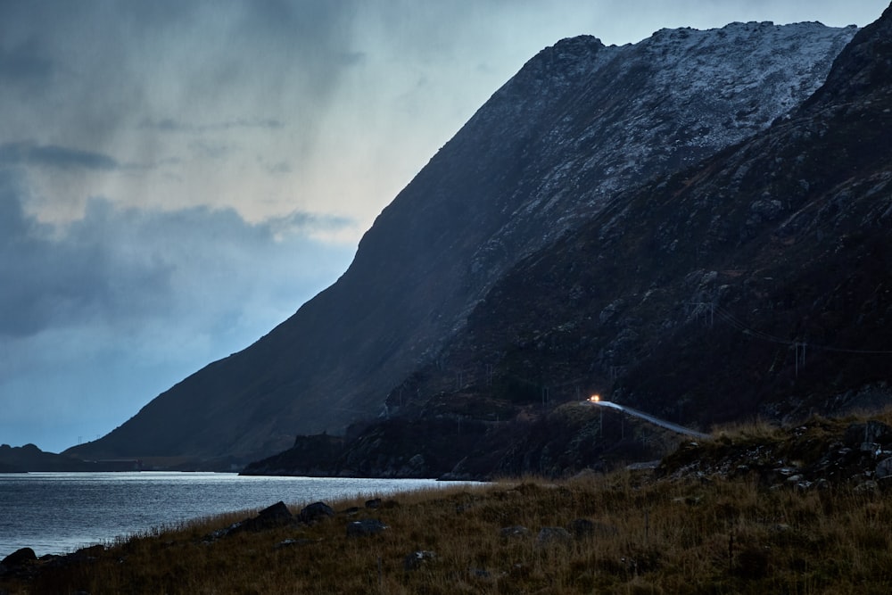 mountain near body of water