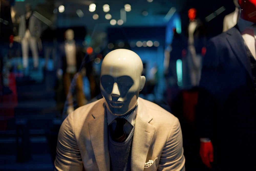 mannequin in brown formal jacket