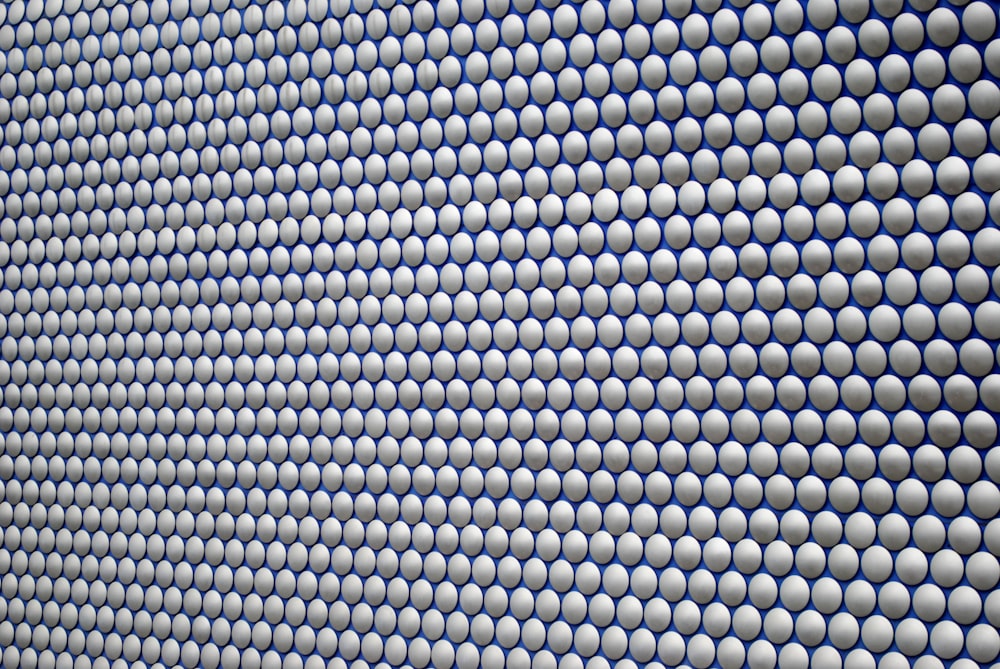 a close up of a wall made of circles