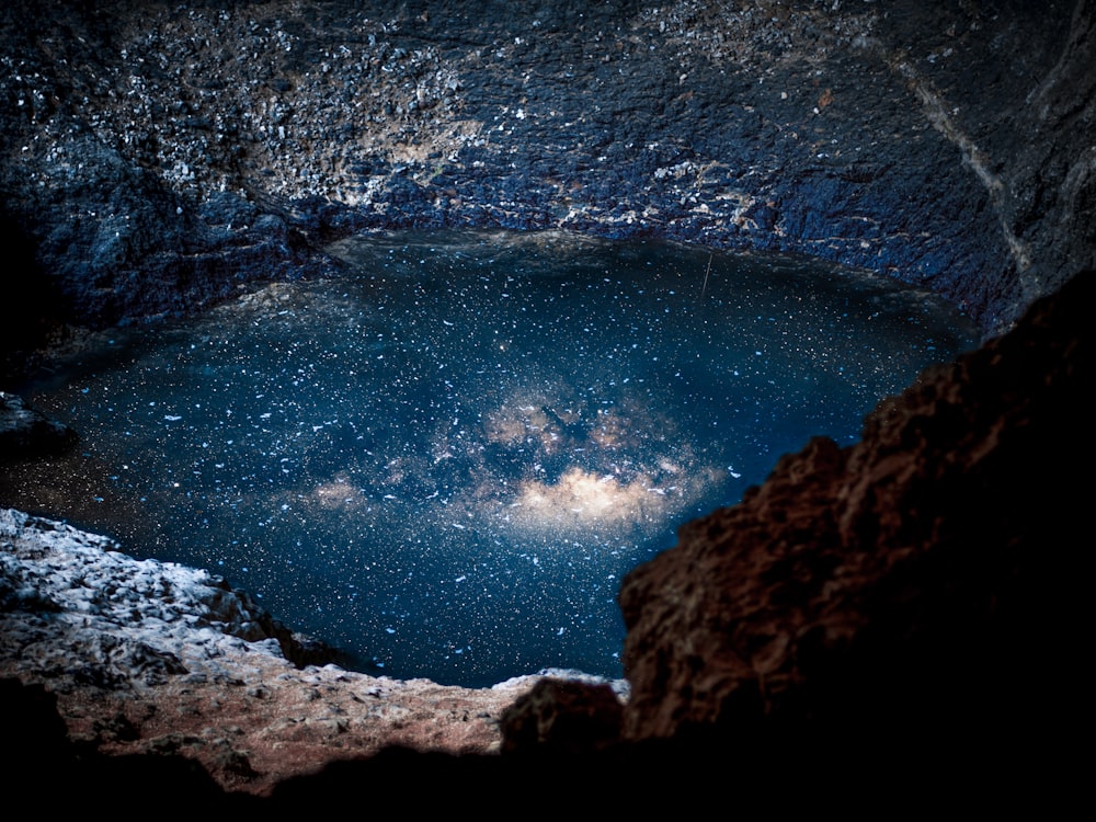 body of water reflecting night sky