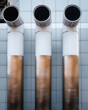 A high-quality installation of helium exhaust pipes in a medical facility.