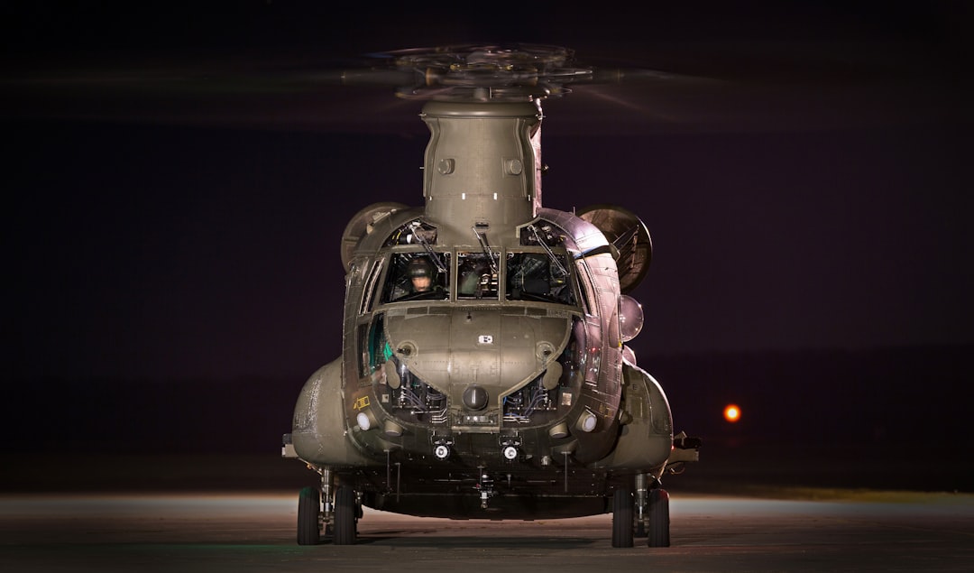 gray helicopter on land at night time, Night shoot at RAF Odiham gave me the opportunity to capture the stalwart workhou
