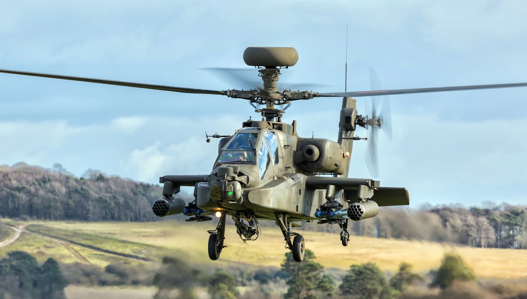 grey Chinook fighter plane, Apache Longbow helicopter on a training sortie