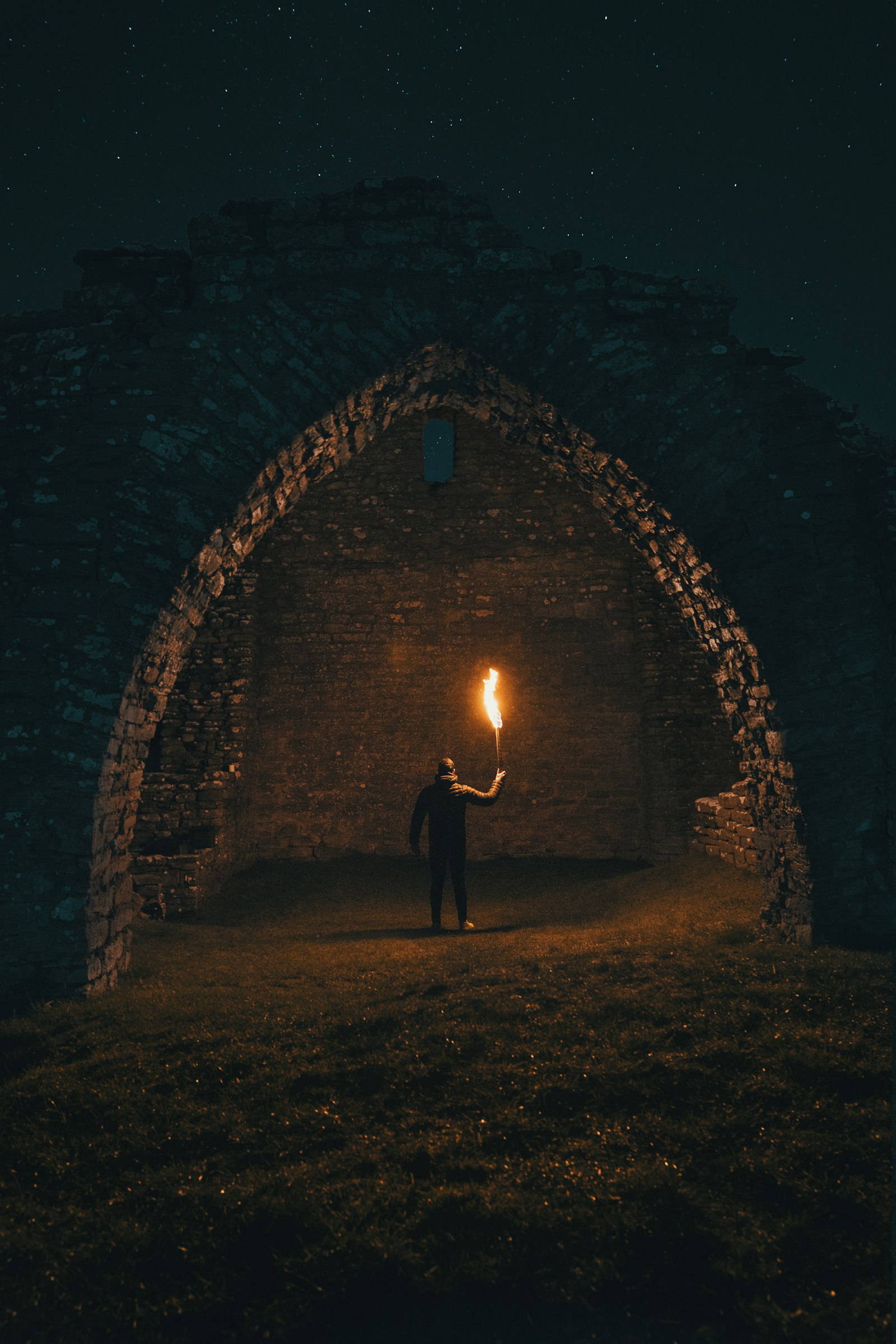 Sony a7R II + Sony FE 24-70mm F2.8 GM sample photo. Person holding torch in photography